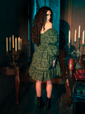 The Allerdale Moth Wallpaper Babydoll Dress is a key to a secret garden, its olive hue and moth pattern a map to hidden realms. This dress, airy and ethereal, offers a glimpse into a world where gothic beauty blooms in the most unexpected places, inviting the wearer to lose themselves in the mystery of the night.