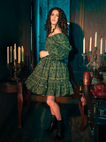  Enveloped in the olive enchantment of the Allerdale Moth Wallpaper Babydoll Dress, you are a vision of gothic grace. The dress, with its playful yet poignant moth design, flutters with the mysteries of CRIMSON PEAK™, inviting onlookers to delve deeper into the story woven within its fabric.
