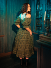 Drawing inspiration from the lush, enigmatic gardens of Victorian fantasies, the CRIMSON PEAK™ Allerdale Moth Wallpaper Babydoll Dress in Olive is a modern homage to an era of unspoken desires and hidden beauty. The moths, fluttering across the fabric, serve as guardians of the night, weaving a spell of enchantment around the wearer.