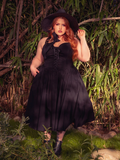 Indulge in the dark sophistication of the Ambrosia Dress in Black. Its sleek silhouette and flowing fabric make it perfect for evening galas and shadowy dances, evoking a sense of timeless allure.