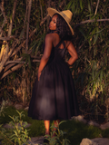 The Ambrosia Dress in Black is a hauntingly romantic creation. Its sleek design and flowing fabric create an air of mystery and enchantment, perfect for moonlit gatherings and midnight dances.
