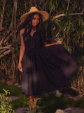 Embrace the night with the Ambrosia Dress in Black. This timeless piece, with its elegant silhouette and rich, dark hues, is ideal for twilight gatherings and moonlit walks.
