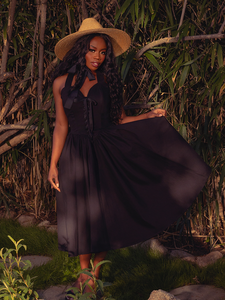 Embrace the night with the Ambrosia Dress in Black. This timeless piece, with its elegant silhouette and rich, dark hues, is ideal for twilight gatherings and moonlit walks.