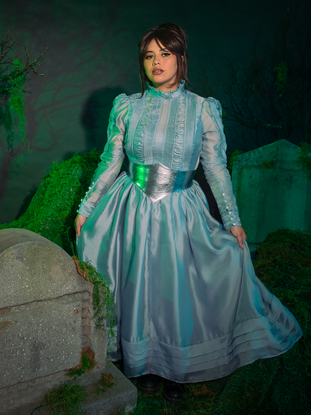 A bewitching full-length shot of the Beetlejuice Beetlejuice™ Astrid Afterlife Dress, with hypnotic black-and-white stripes cascading in sleek perfection—ideal for midnight mischief.