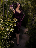 A classic form-fitted piece of gothic clothing, this wiggle dress sculpts the body with vintage venom and romantic restraint.