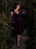 The skirt flares out beautifully mid-twirl, capturing the dress’s vintage-inspired volume and movement.