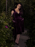 A detailed shot of the plum fabric, showing the lush, matte finish and precise stitching of the bodice.