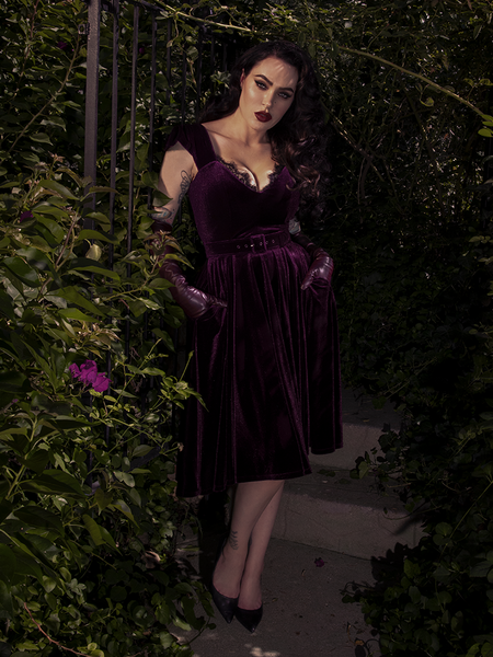 A detailed shot of the plum fabric, showing the lush, matte finish and precise stitching of the bodice.