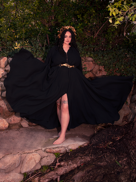 Bathed in twilight, the gothic clothing silhouette stuns with sacred shadows and allure.