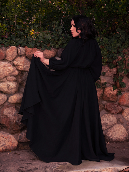 Velvet whispers in this gothic dress, catching candlelight and hearts with equal ease.