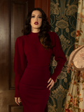 Crafted for the fearless and the elegant, this deep crimson cycling pullover’s structured bodice and voluminous sleeves bring Victorian romance to the modern wardrobe.