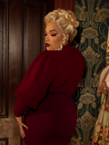Ride into Victorian splendor with this crimson cycling pullover, boasting a structured bodice, voluminous sleeves, and ornate buttons for timeless elegance.