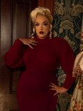 Evoke Victorian passion in this crimson cycling pullover, designed with a high neckline, soft knit fabric, and puffed sleeves for a regal, vintage-inspired silhouette.