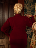 This crimson cycling sweater captures the essence of gothic romance, featuring dramatic bishop sleeves and a structured fit to elevate any darkly elegant ensemble.