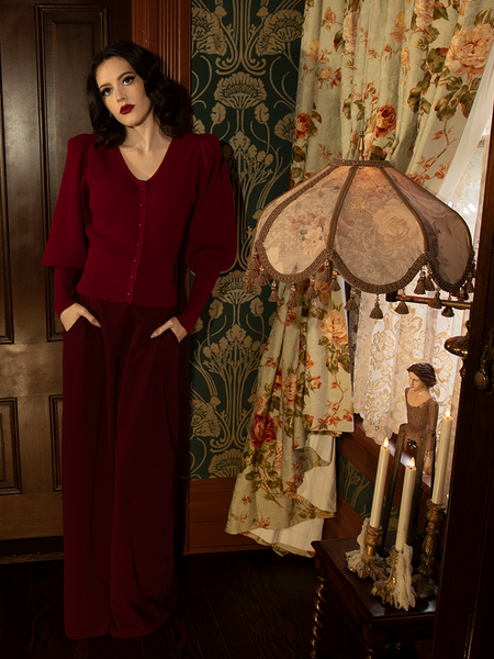 Fluid like a dark river under the full moon, these oxblood pants shimmer with subtle menace and sophisticated grace.