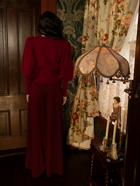 Oxblood—deep, devout, and delicious—wraps around the body like whispered sin in this decadent palazzo silhouette.