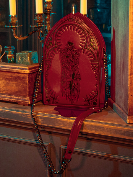 Mesmerizing models showcase the hauntingly gorgeous CRIMSON PEAK™ Ghost Shoulder Bag from the gothic clothing brand La Femme en Noir.