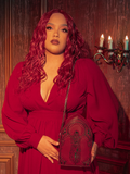 Captivating models bring to life the haunting allure of the CRIMSON PEAK™ Ghost Shoulder Bag from the gothic clothing brand La Femme en Noir.