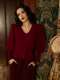 Perfect for layering, this deep crimson Victorian cardigan pairs structured knit with romantic pleats and vintage-style buttons for an effortlessly elegant finish.