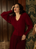 Embrace the poetry of the past with this luxurious crimson knit cardigan, where warmth meets Victorian charm in a stunningly detailed, fitted silhouette.