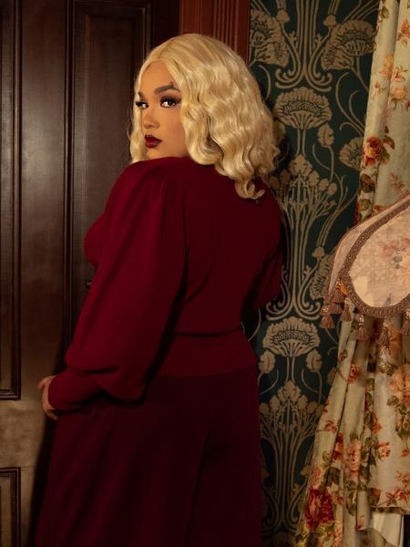 Wrap yourself in Victorian romance with this deep crimson knit cardigan, boasting puffed sleeves, delicate pleats, and a structured fit for timeless allure.