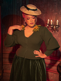 Drape yourself in the mysteries of old England with this olive Victorian knit cardigan. Its chunky, textured knit and deep olive hue evoke the foggy moors, perfect for layering over lace blouses or under structured coats for a truly gothic look.