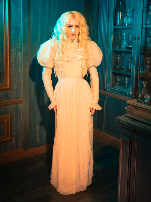 With its pristine ivory hue, the Edith Victorian Gown captures the essence of untouched elegance. The sumptuous blend of silk and lace drapes the body in a celebration of femininity, its flowing skirt whispering tales of secret rendezvous and forbidden love. This gown is a testament to the enduring allure of Victorian sophistication.