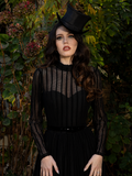Bathed in shadowed elegance, the high-neck design and long sleeves of the Funeral Dress offer a silhouette of refined mourning.