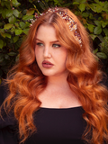Adorn your tresses with the Garnet Rhinestone Floral Leaf Hair Wire in Gold, a delicate twist of opulence. Crimson stones bloom like mystical flowers amidst golden leaves, making it a perfect accessory for weaving an air of enchantment into any updo.