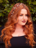 The Garnet Rhinestone Floral Leaf Hair Wire in Gold is a crown of nature’s finest, blending rich crimson rhinestones with golden leaves. Perfect for gothic queens, it adds a touch of regal glamour, illuminating your locks with a celestial glow.