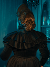 The Victorian Mourning Dress whispers elegance, its capelet fluttering like the soft words of comfort in times of sorrow. Each stitch is a note in a requiem for the past, a melody of beauty found in the depths of grief.
