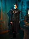 The Haunted Beauty dress is an elegy of lace, its capelet a final verse in a poem dedicated to the departed. This ensemble is a bridge between the world of the living and the memories of those we hold dear, a testament to the enduring allure of Victorian mourning traditions.