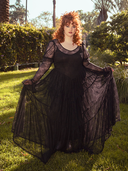 Whispering secrets of bygone eras, the Juliet Sheer Lace Maxi Dress in Black cloaks the wearer in delicate lace, evoking Victorian grace and dark romance.