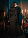The Lady Mourning Victorian Gown captures the solemn beauty of mourning with unparalleled grace. Its fabric clings and cascades, echoing the fluidity of grief, while the intricate lace work adds a layer of delicate beauty to the solemnity. This gown is a wearable tribute to the art of mourning, embodying both loss and the eternal beauty that lingers.