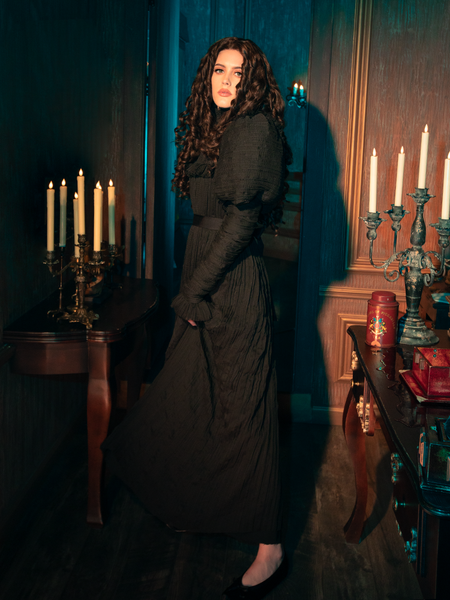 Like a rare blossom that blooms in the shadow of the moon, the Lady Mourning Victorian Gown stands out with its exquisite beauty. The black velvet material flows like night, while lace accents bloom across the fabric, creating a stunning visual that's as captivating as it is unique.