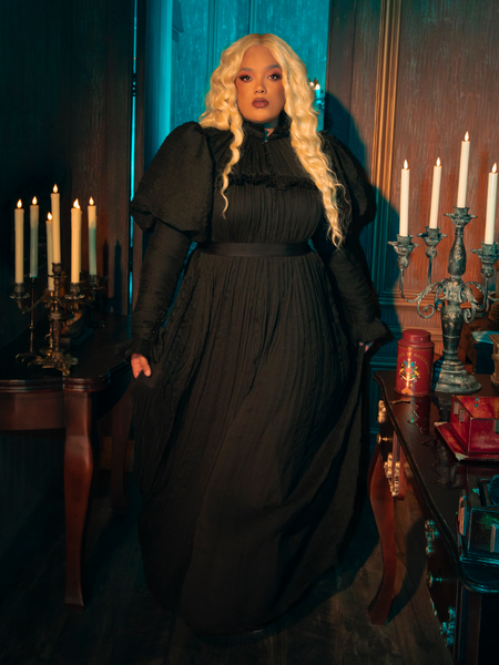 The Lady Mourning Victorian Gown weaves an enchanted nocturne with its deep black velvet and cascading lace. Each detail is a note in a symphony of elegance, designed to enchant and captivate.