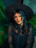 Add a dash of spectral style with the Beetlejuice™ Lydia Deetz Open Crown Hat. Inspired by Lydia's iconic look, this wide-brimmed beauty with its open crown brings gothic charm and a touch of rebellious spirit to any ensemble, perfect for fans of the macabre.