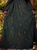 The model spins or lifts part of the skirt, revealing layers and the sheer quality of the lightweight material.