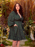 Turn heads and hearts in this faux wrap dress, where swirling serpentine patterns evoke Medusa’s mythic power. With its figure-flattering design and enchanting print, it’s perfect for moonlit galas or daring daywear.