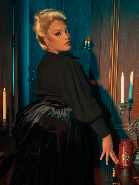With striking elegance, gothically beautiful female models pose in the Victorian Mourning Knit Cardigan in Black, adding depth to its allure.