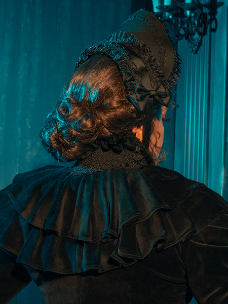 Embrace timeless grace with this black Victorian bonnet, featuring soft velvet and a lace trim that whispers tales of yore.
