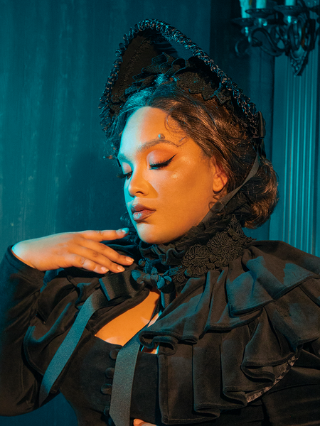 A tribute to bygone beauty, this bonnet pairs lush fabrics with a veil of lace, perfect for solemn occasions or gothic gatherings.