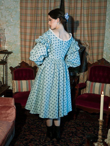 Step back in time with the Ellen Victorian Dress, where gothic elegance meets a wistful floral pattern for an unforgettable, haunting style.