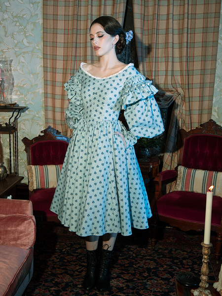 Ethereal yet bold, this dress’s blue floral design and Victorian cut create a look that’s equal parts haunting and breathtaking.