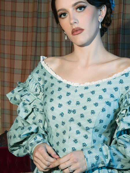 Soft, flowing fabric and an intricate blue floral pattern define the Nosferatu Ellen Dress, a masterpiece of Victorian-inspired allure.