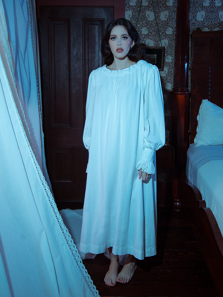 Channel quiet sophistication in this sleeping dress, its flowing ivory fabric and timeless Victorian touches designed for tranquil evenings.