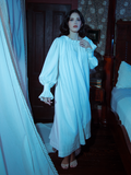 A vision of vintage-inspired elegance, this sleeping dress features a flowing silhouette and delicate accents in a dreamy ivory hue.