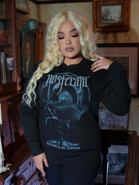 The Nosferatu Castle Sweatshirt embodies dark romance, with its cozy fit, deep black fabric, and a castle graphic straight from classic horror lore.