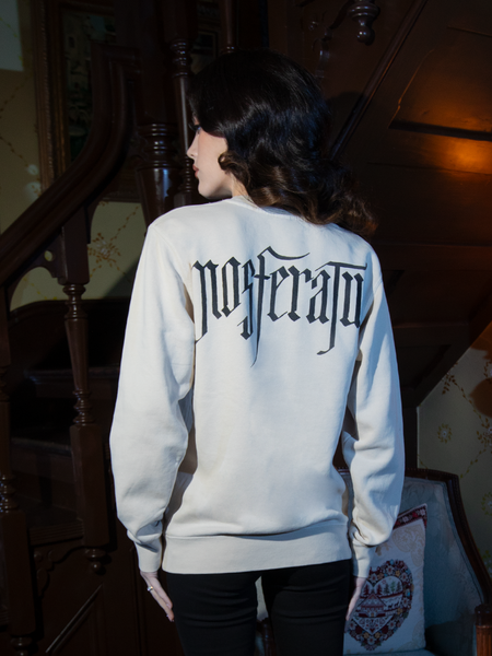 Perfect for layering with dark accessories, the Nosferatu Contract Sweatshirt in Bone features a chilling design inspired by the iconic vampire.