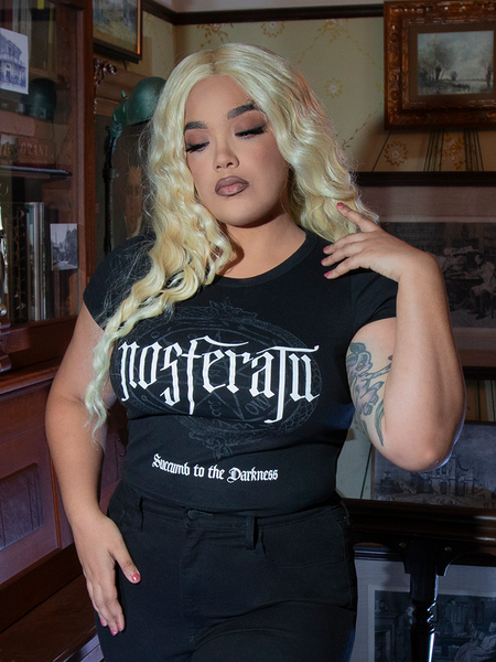 With a Count Orlock sigil emblazoned across deep black fabric, this gothic baby doll T-shirt is perfect for daydreams or midnight mischief.